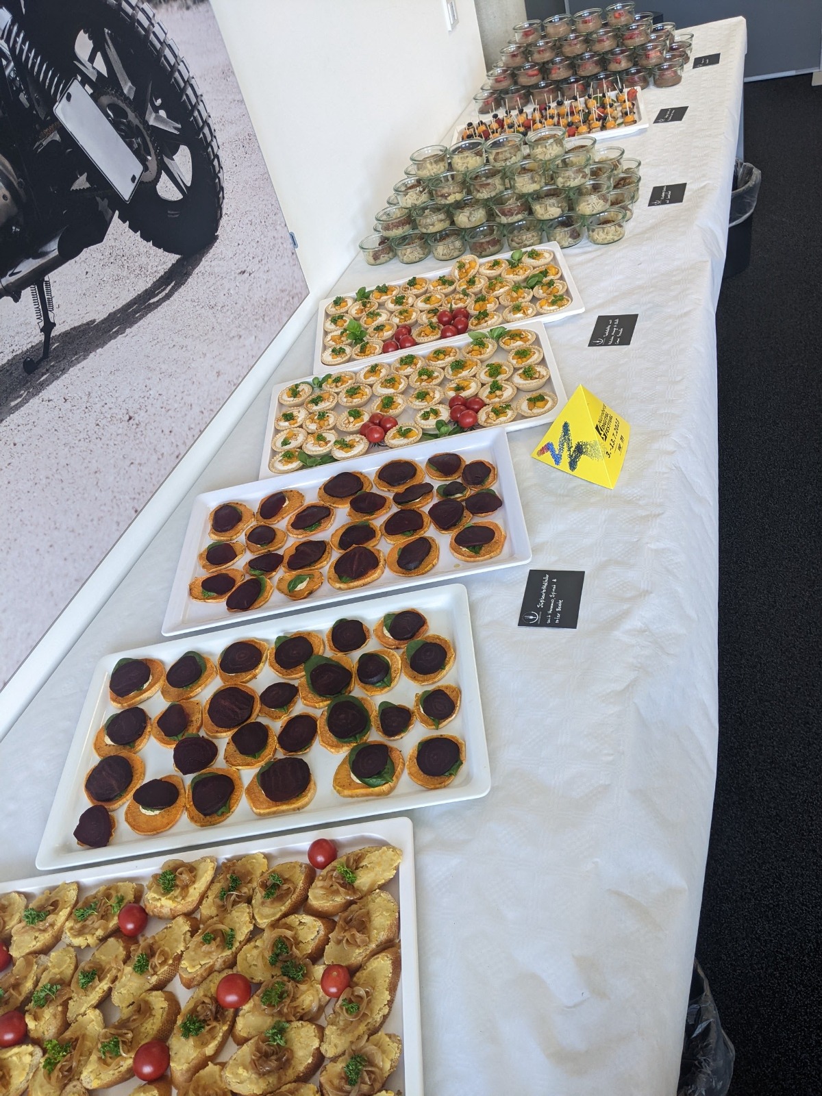 Daytime catering table filled with seasonal bites and greenery.