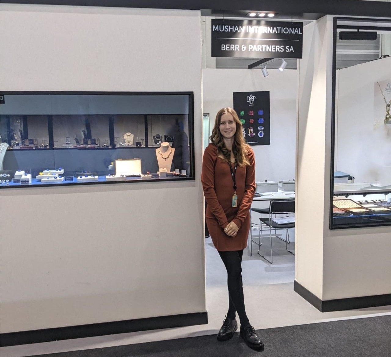 Trade show booth with branded signage welcoming attendees.
